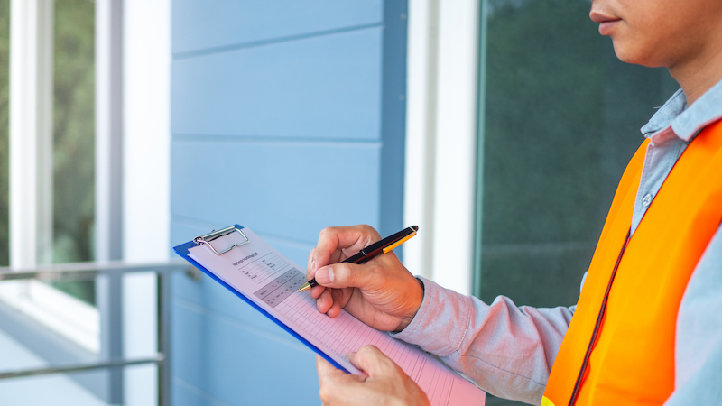 Loss Consultant Checking Documents at a Property Site